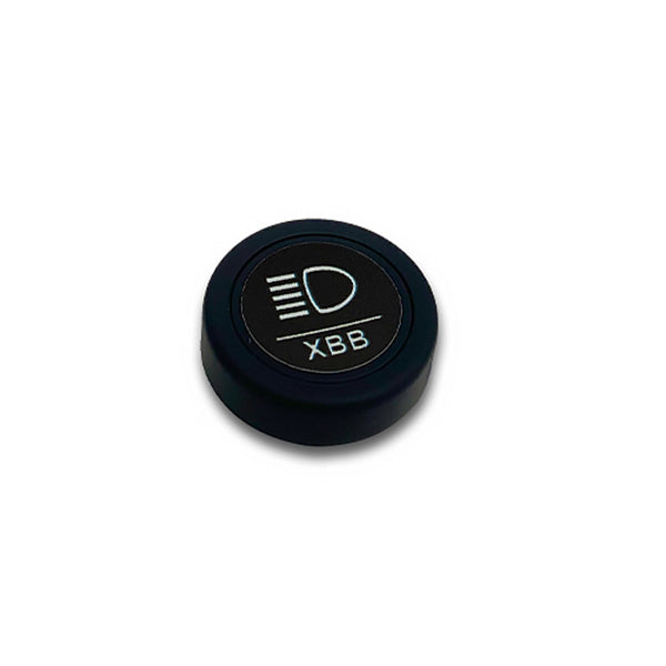 XBB Smart Button langaton kytkin lisävalolle ilman tuotepakkausta. Kuvassa valkoinen tausta ja kuva otettu ylhäältä.